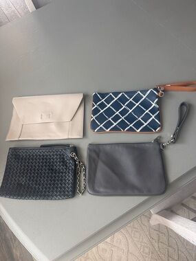 Beige Clutch, black/gold  clutch, gray clutch and navy/tan clutch